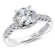 An elegant halo style diamond engagement ring set in 14k white gold.