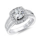 A wonderful split shank engagement ring with a cushion shape halo of diamonds surrounding the round center stone. 