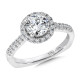 Simple elegance is reflected it the quality craftsmanship of this halo engagement ring set in 14k white gold.