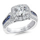 Diamond and sapphire halo style engagement ring set in 14k white gold.