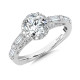 The center stone shines magnificently next to its petite prong-set halo and baguette accented shoulders. R1062W