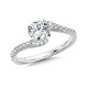 A single row of diamonds makes up both sides of this bypass shank design.  Unlike normal spiral rings, the shank doesn’t smoothly encircle the center stone.  R1064W