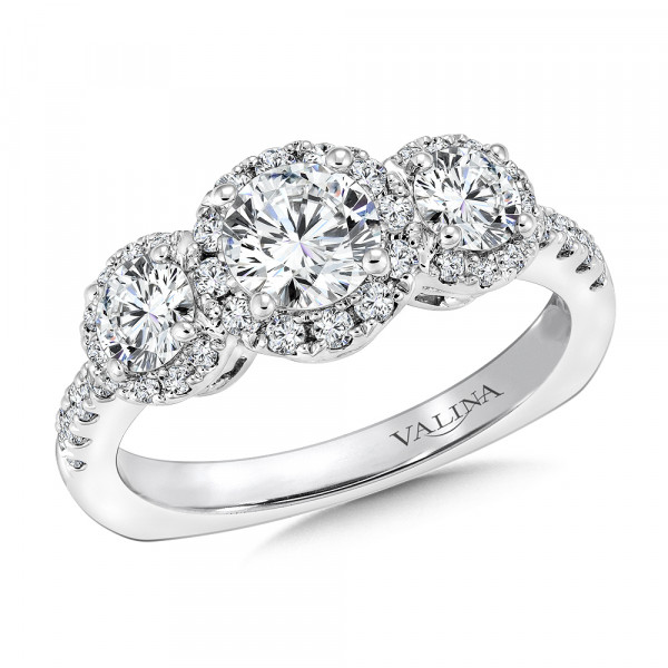 This special three stone engagement ring is completed with three diamond halos.