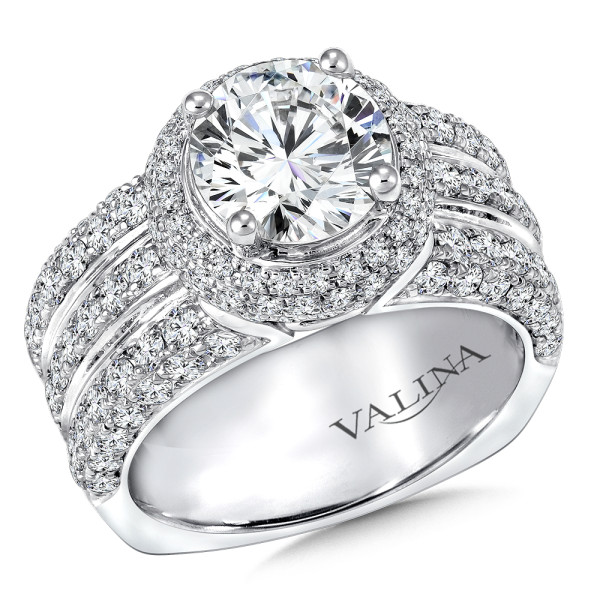 Three rows of diamonds in the band makes a big statement with this halo style engagement ring.