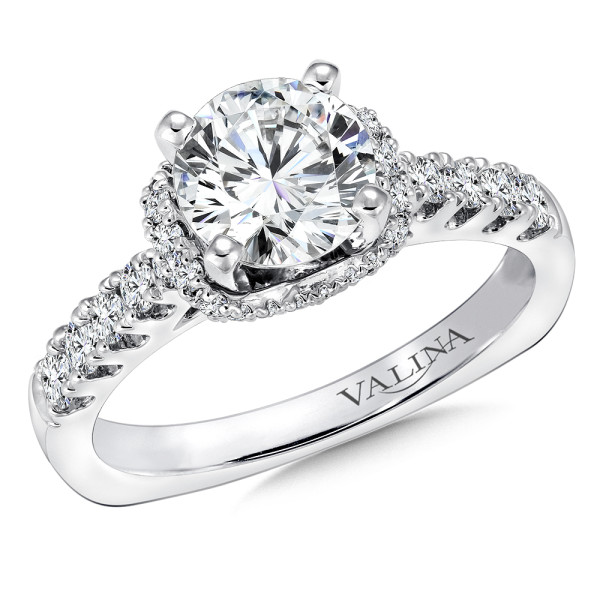 An elegant halo style diamond engagement ring set in 14k white gold.