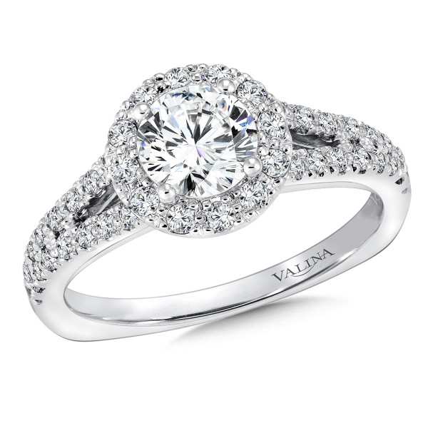 Split shank diamond halo engagement ring.