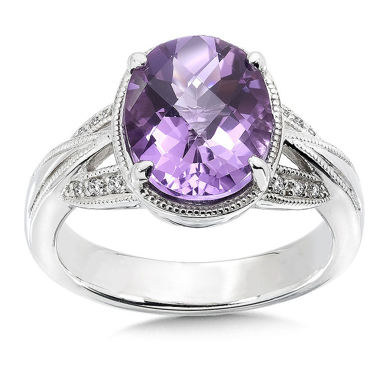 Sterling Silver ring with oval amethyst center and diamonds.